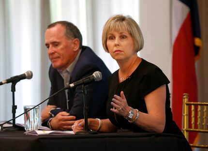 Missy Bender, Plano ISD school board president, speaks as Todd Williams, executive director...