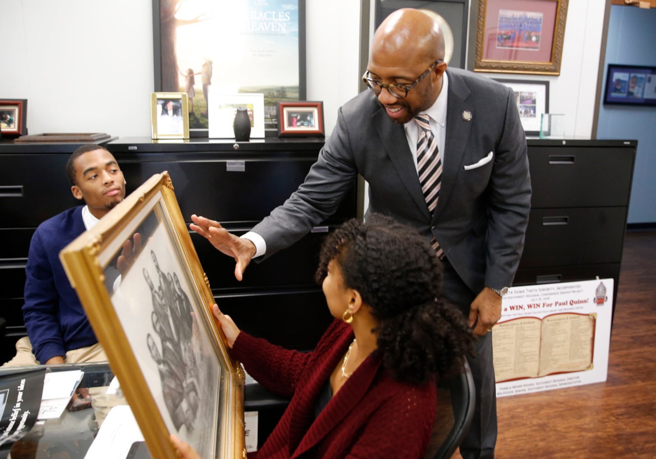 Michael Sorrell, president of Paul Quinn College, talks to Aden Jemaneh (right) of Irving...