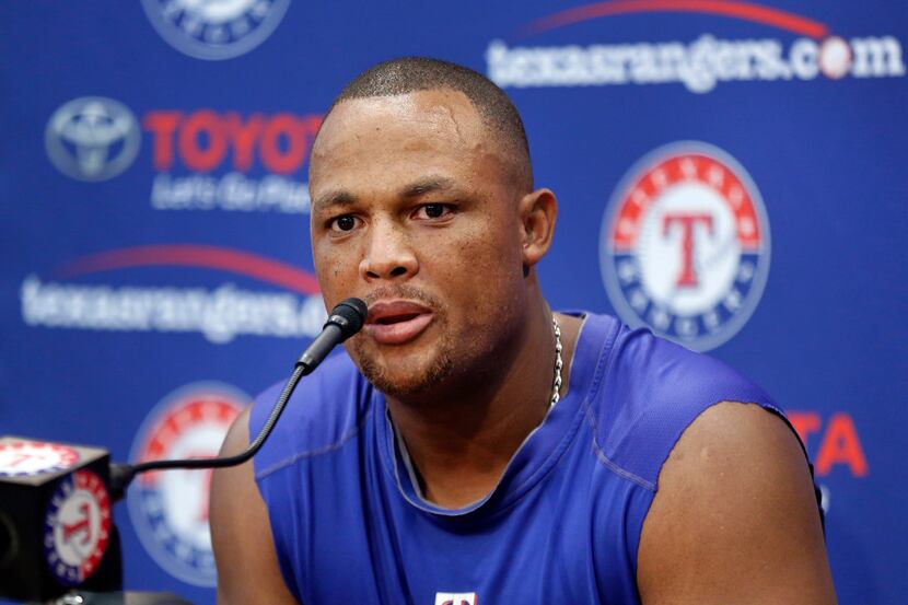 Texas Rangers Adrian Beltre speaks during a press conference following the game in which he...
