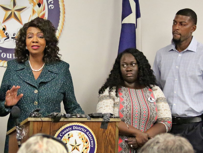 Jordan Edwards' stepmother Charmaine Edwards (center) and father Odell Edwards listen as...