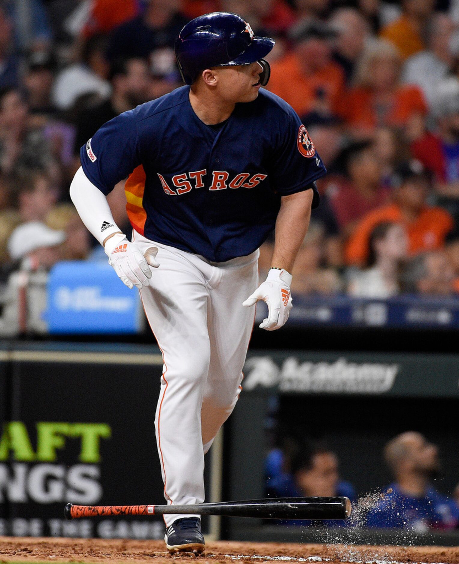 Houston Astros' Aledmys Diaz watches his grand slam off Texas Rangers starting pitcher Kyle...