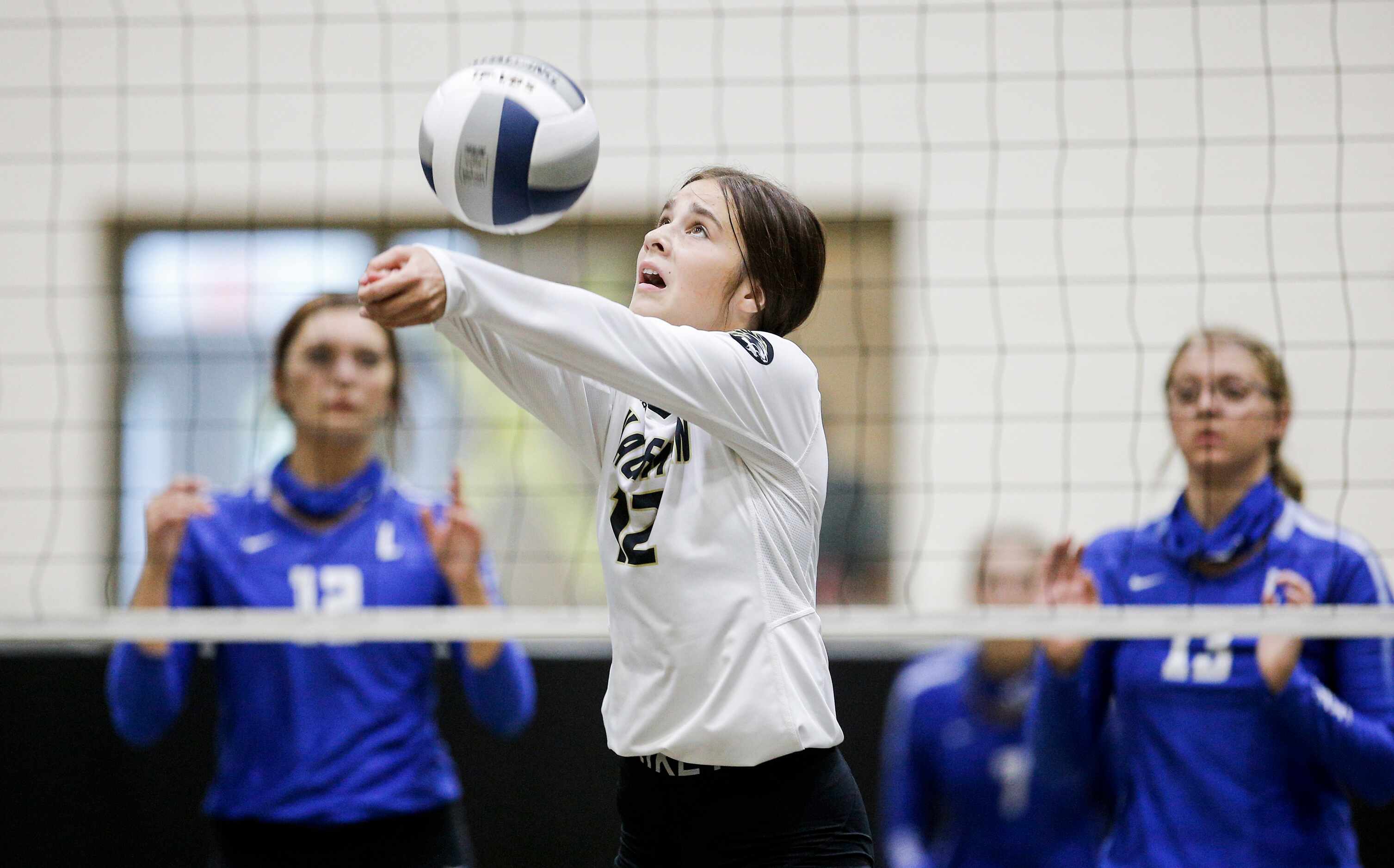 KaufmanÕs Piper Wilburn (12) bumps the ball during a high school volleyball match against...