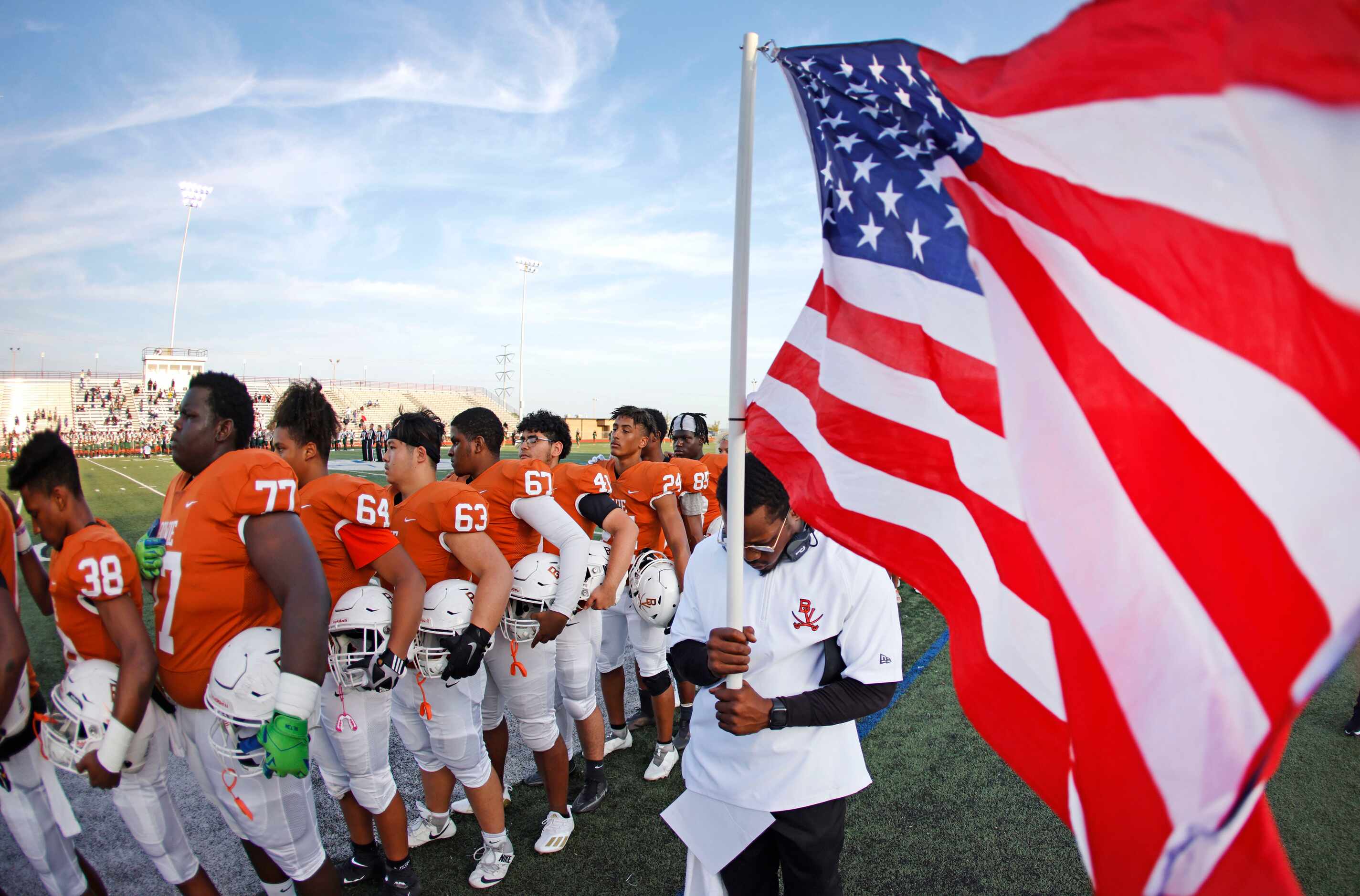 Arlington Bowie stands for the national anthem before playing DeSoto Friday Sept. 3, 2021,...