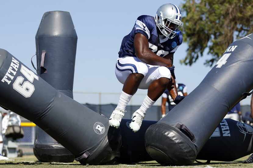 Dallas Cowboys defensive end Charles Tapper battles through the blocking dummies during...