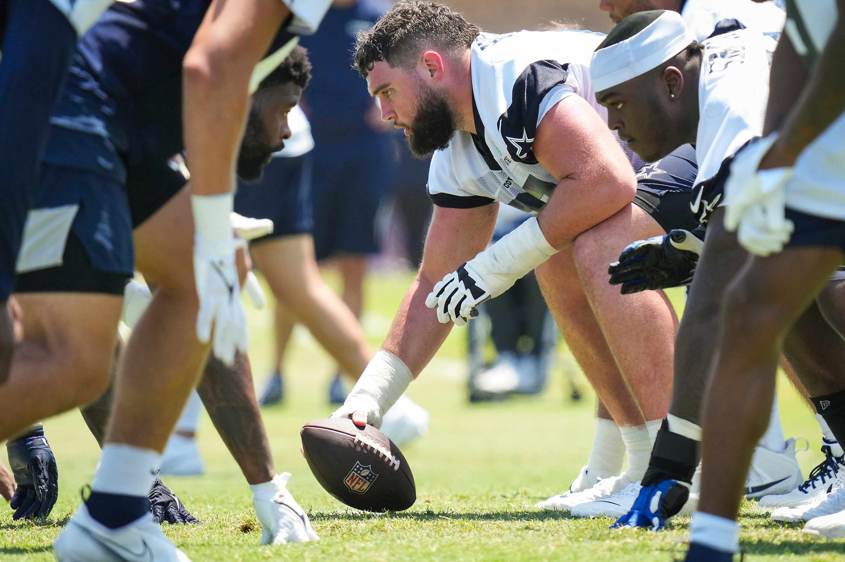 Dallas Cowboys center Brock Hoffman (67) prepares for a snap during a training camp practice...