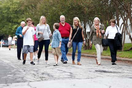 People walk to the Nextdoor block party in the Belmont Addition in Dallas on Sept. 29.