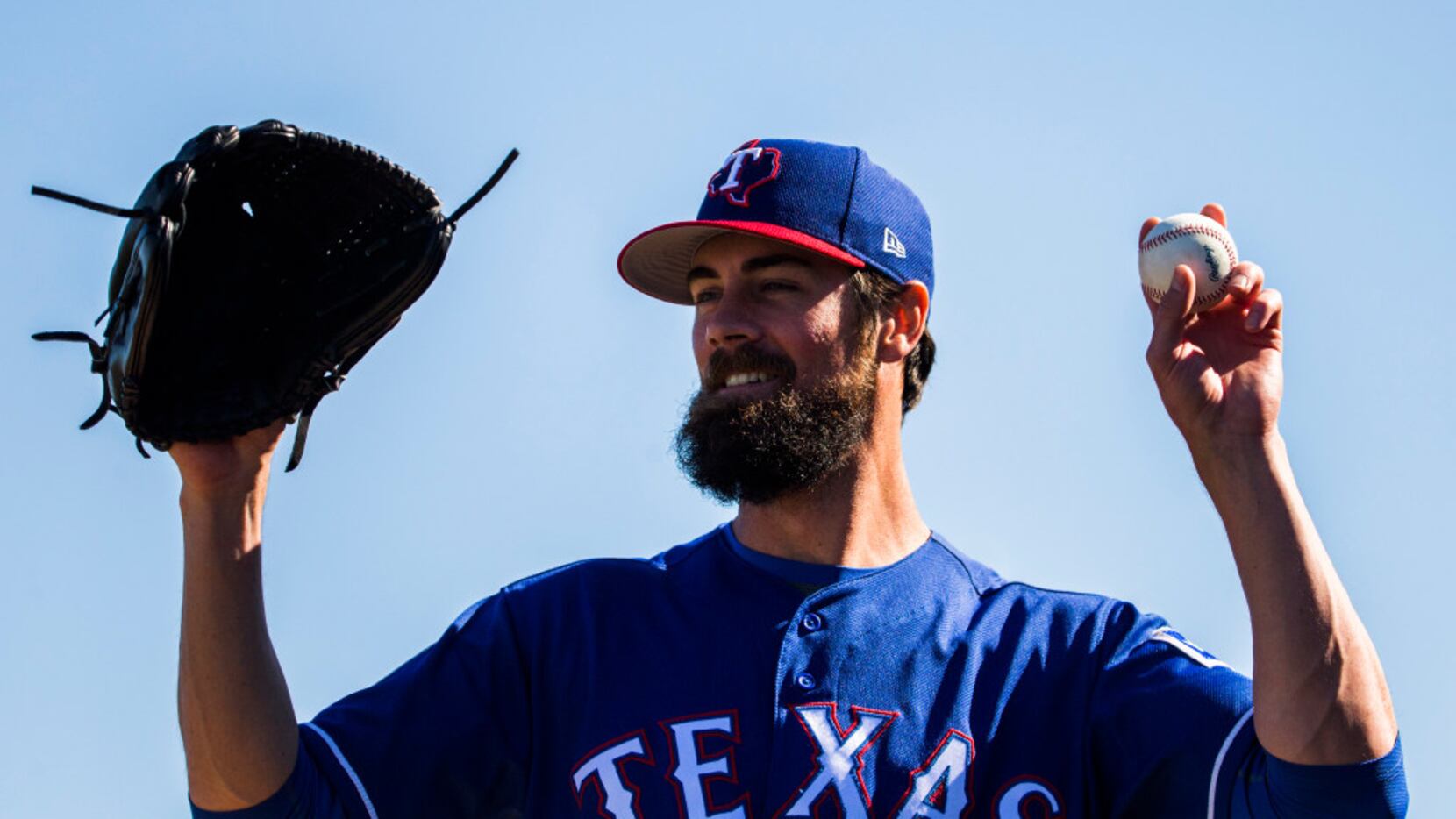 Texas Rangers starting pitcher Cole Hamels (35) prepares to pitch during a spring training...
