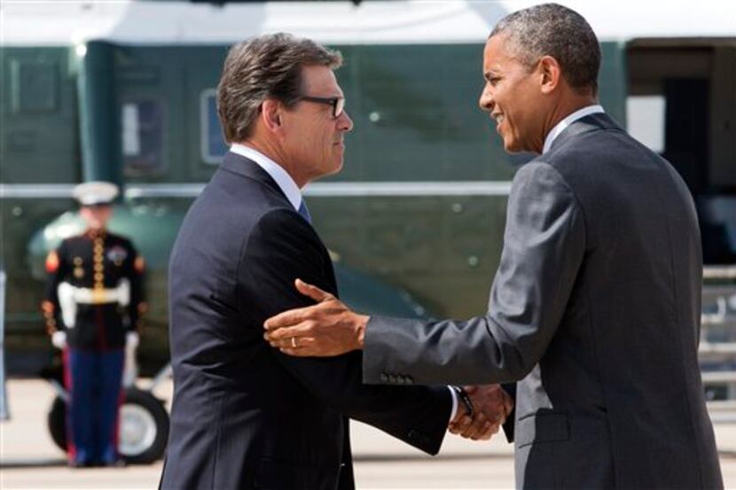 Gov. Rick Perry greets President Obama at Dallas/Fort Worth International Airport before...