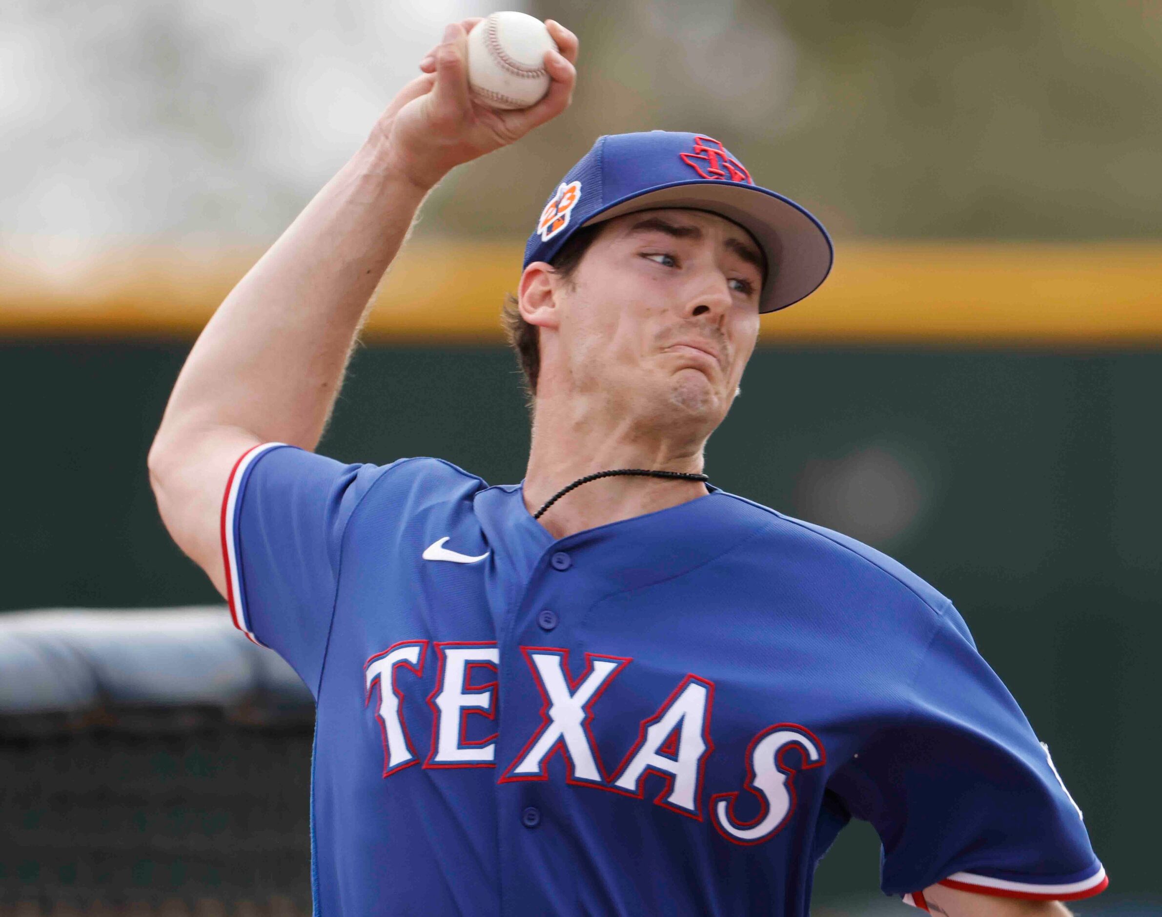 Texas Rangers pitcher Cole Winn throws a pitch during a spring training workout at the...