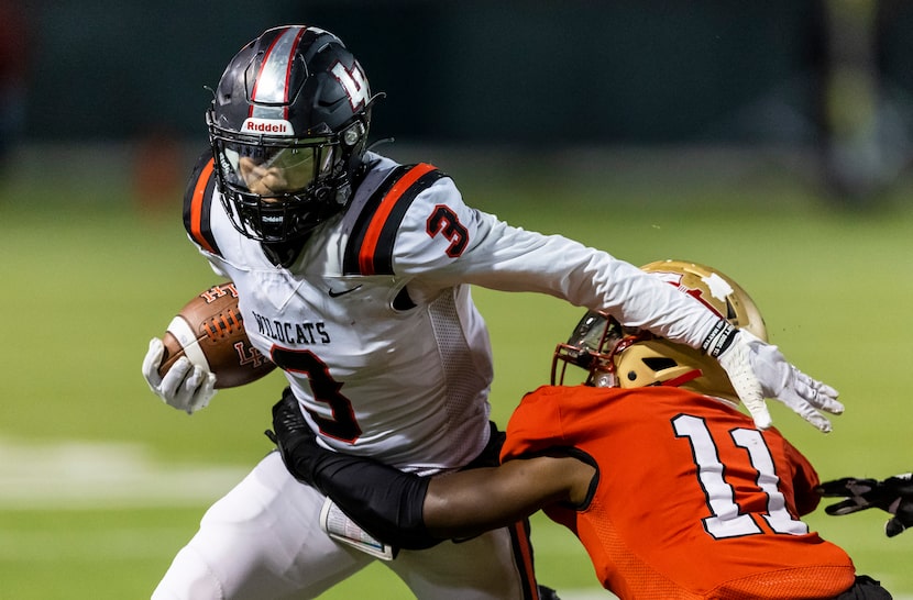 Lake Highlands junior running back Deonte Dean (3) battles junior defensive back Ahmad...