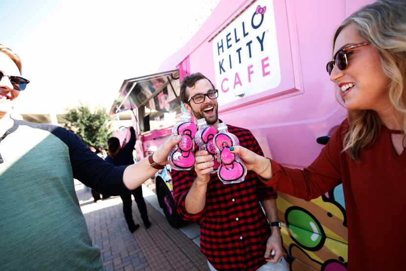 From left, Chad Haecherl, Brendan Woeppel and Chelsea Battig hold their Hello Kitty Bow...