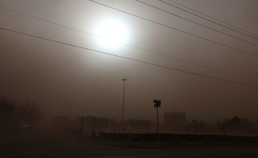 Dust covers a residential area during a dust storm in Lubbock, Texas, Wednesday, Dec. 19, 2012.