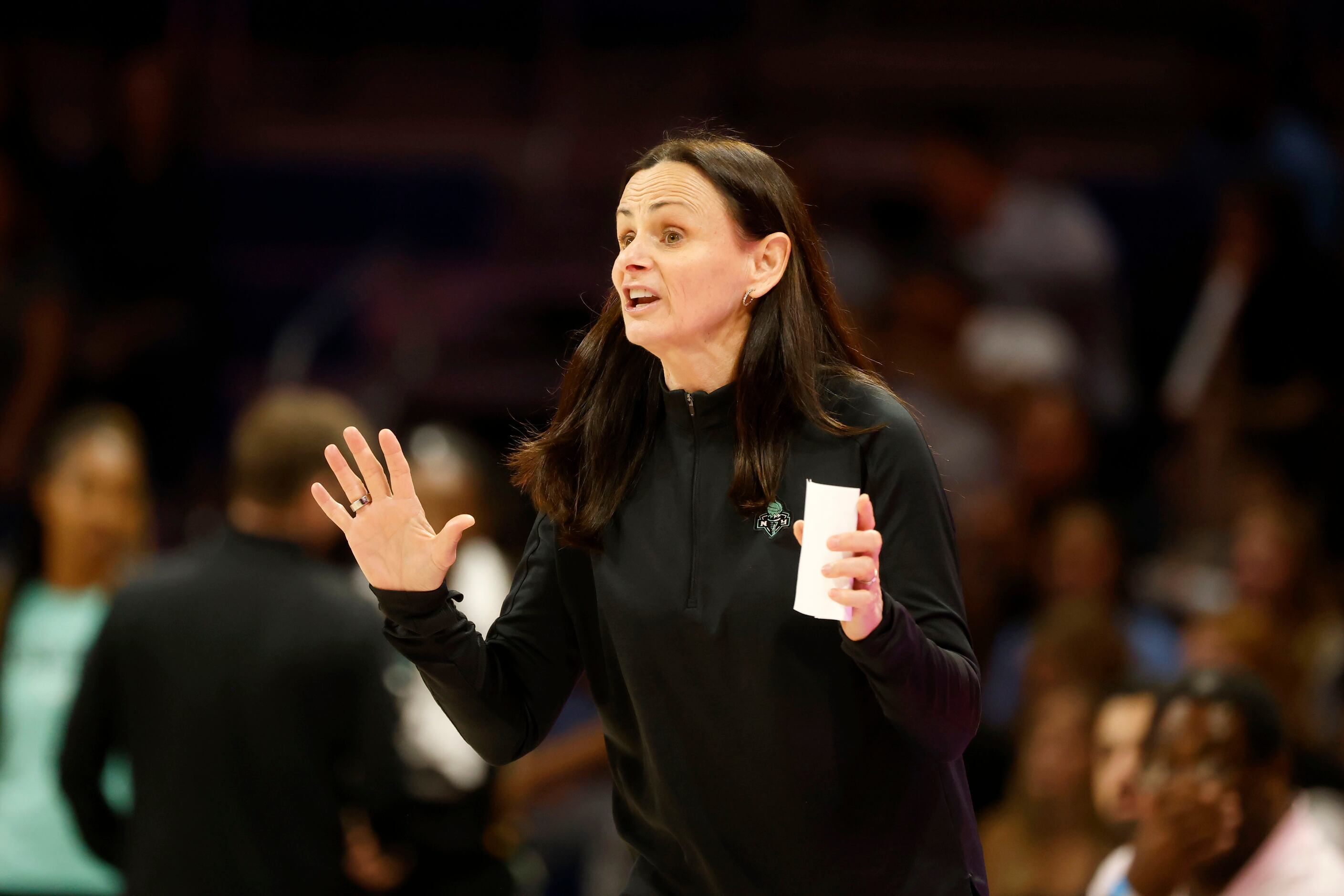 New York Liberty head coach Sandy Brondello directs her team as they play against the Dallas...