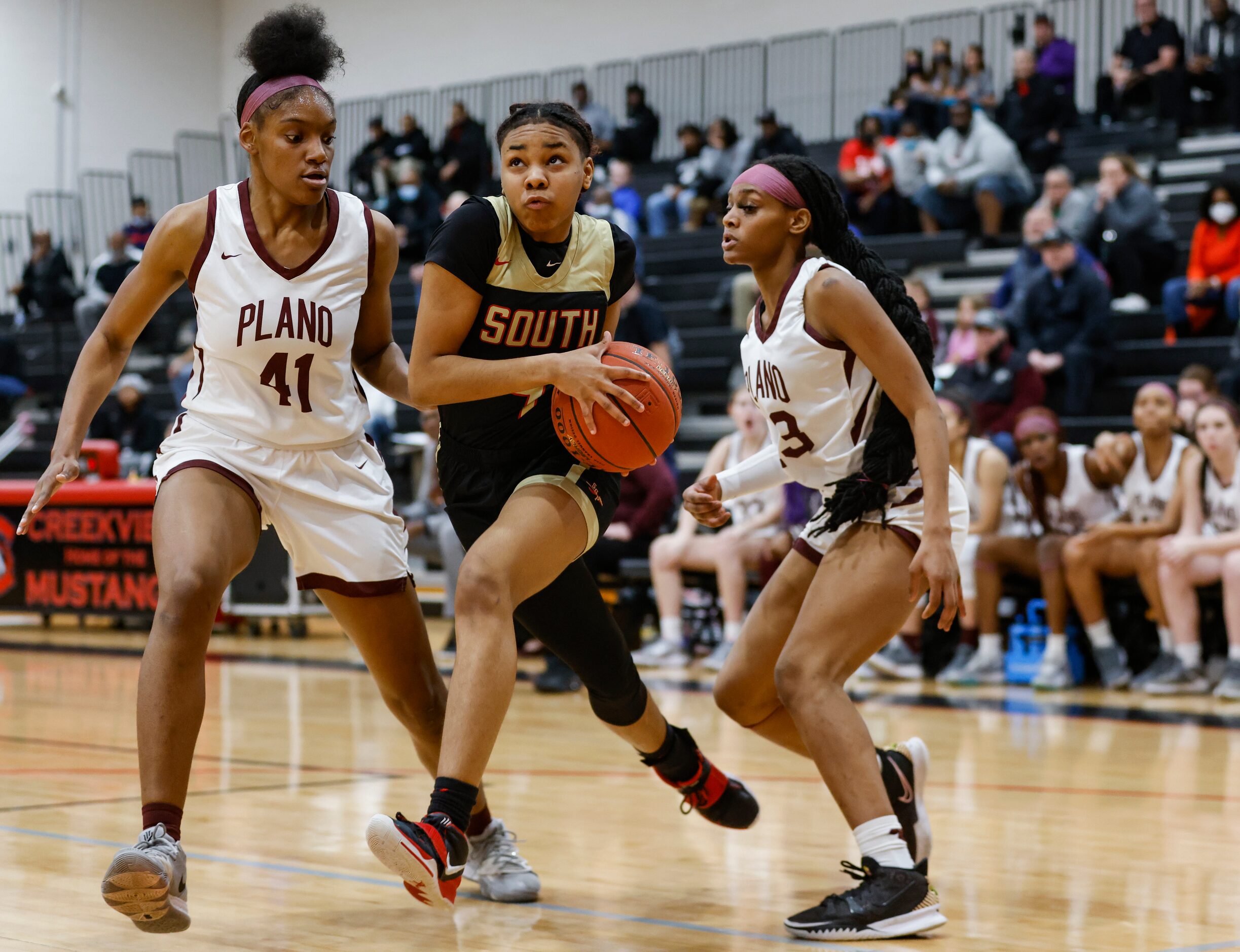 Plano Senior High School Allysa Pendley (41) and Plano Senior High School Jaden Berry (23)...