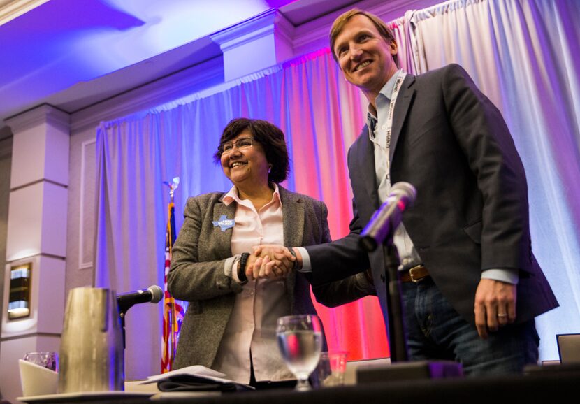 Former Dallas County Sheriff Lupe Valdez, left, shakes hands with fellow Democratic...