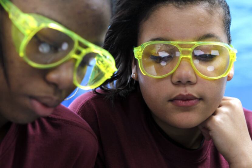 Asheena Murray (left) and Payton Williams, who donned goggles for a biology project last...