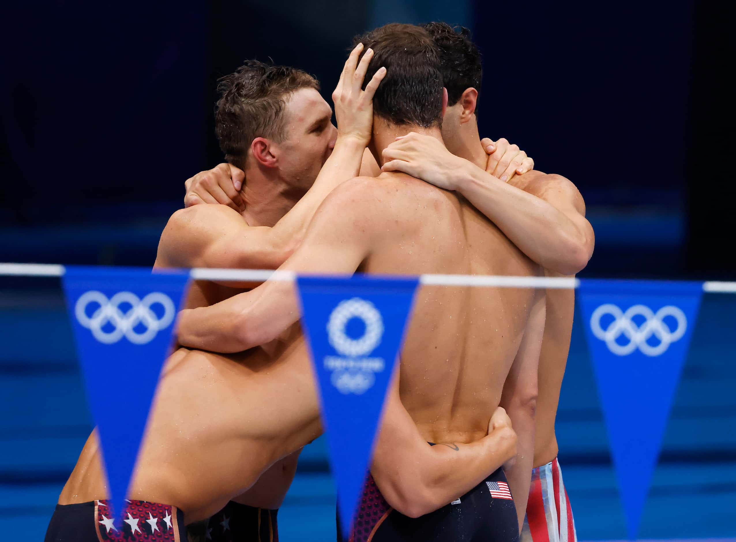 USA’s Ryan Murphy, Zach Apple, Michael Andrew and Caeleb Dressel celebrate setting a new...