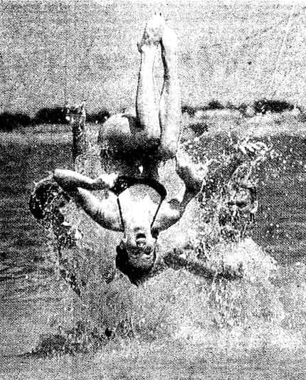 Photograph of a swimmer flipping into Lake Lavon.  Photograph taken on May 27, 1983.