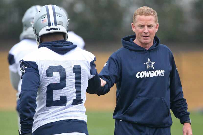 Dallas Cowboys head coach Jason Garrett greets running back Ezekiel Elliott at practice at...