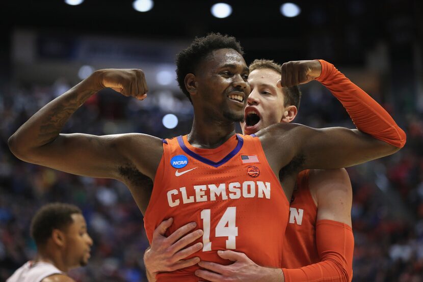 SAN DIEGO, CA - MARCH 18: Elijah Thomas #14 celebrates with David Skara #24 of the Clemson...