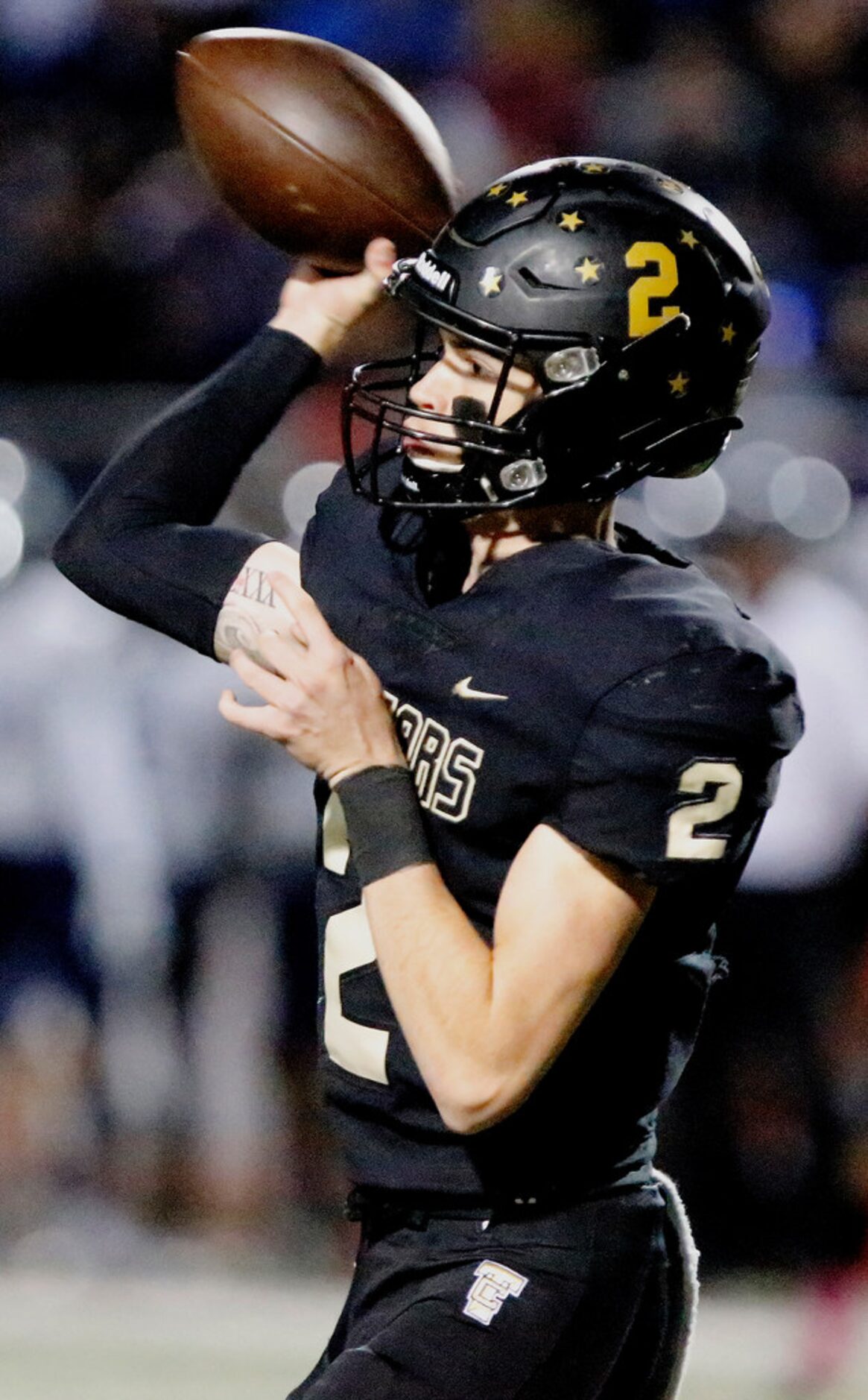 The Colony High School quarterback Kenneth Harrington (2) throws a pass during the first...