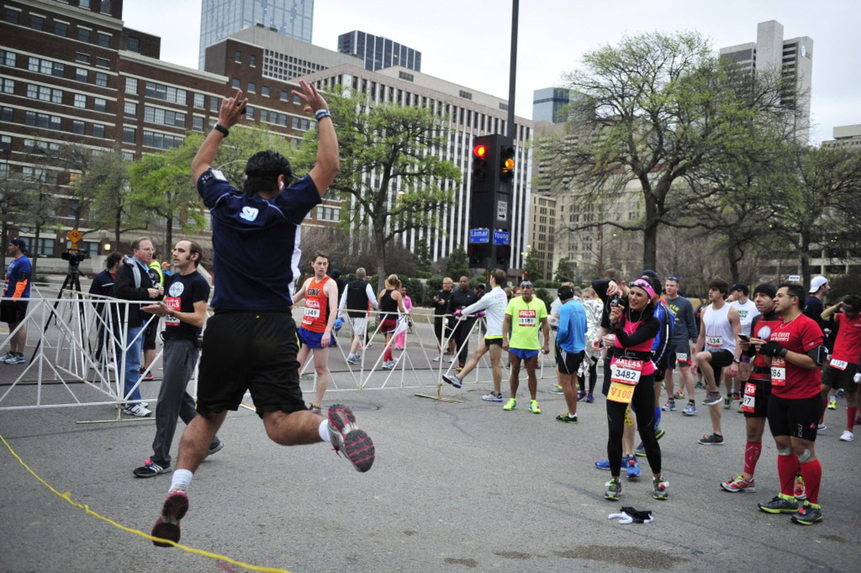 Juan Aguilar has a picture taken of him jumping at the starting line prior to the start of...