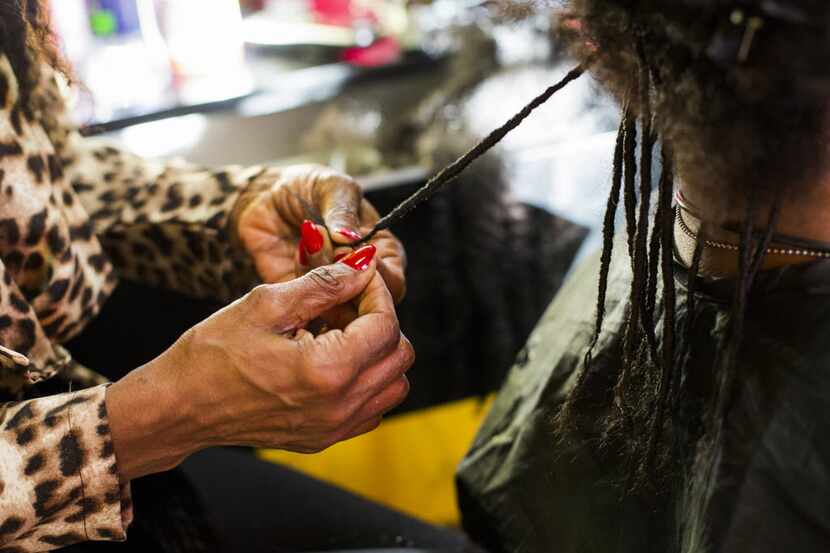  In January, Isis Brantley worked on the hair of her client in her shop. (The Dallas Morning...