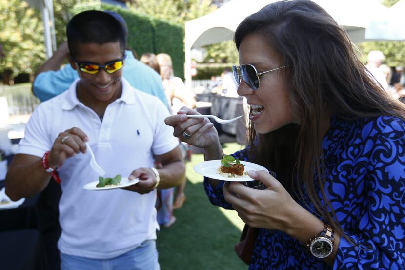 Wei Wong and Marisa Terpkosh sample Blacken Red Snapper from Savor Gastropub at the Park &...