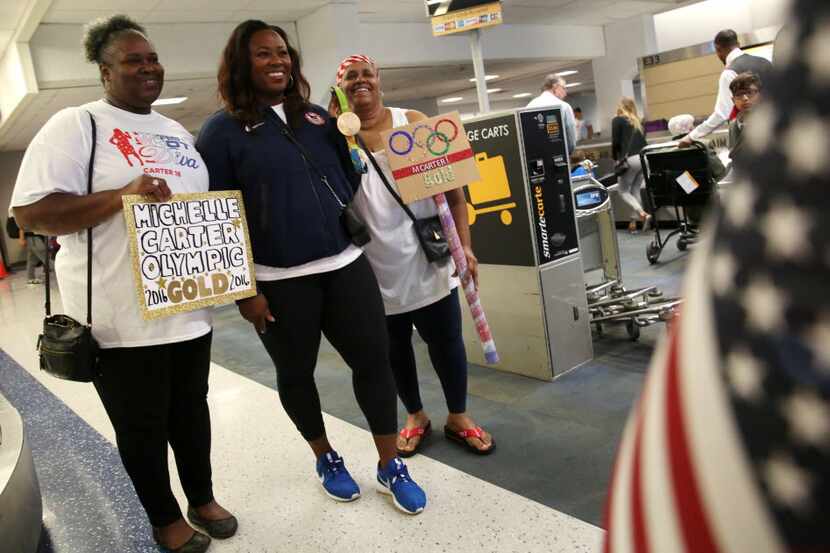 Sandra Carter (left) welcomed her Olympic champion daughter Michelle Carter home Friday with...