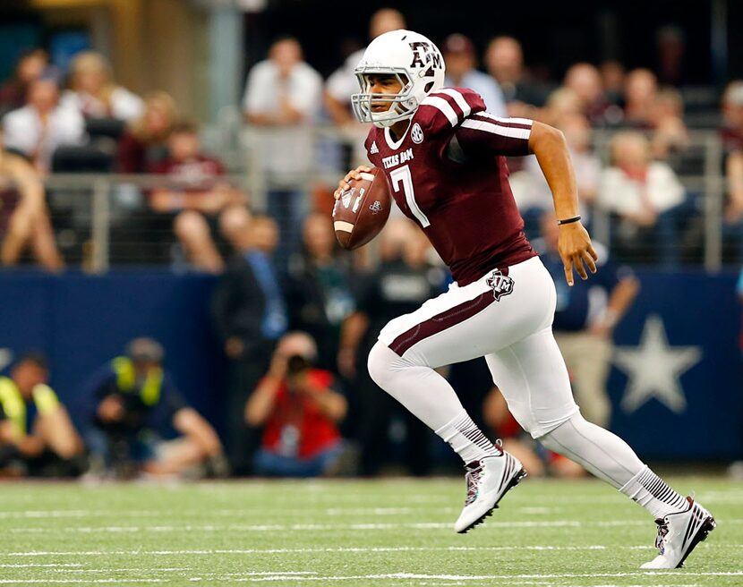 Texas A&M Aggies quarterback Kenny Hill (7) scrambles from the pocket against the Arkansas...