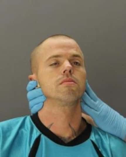  Jason Lee Smallwood had to be restrained for his mug shot.