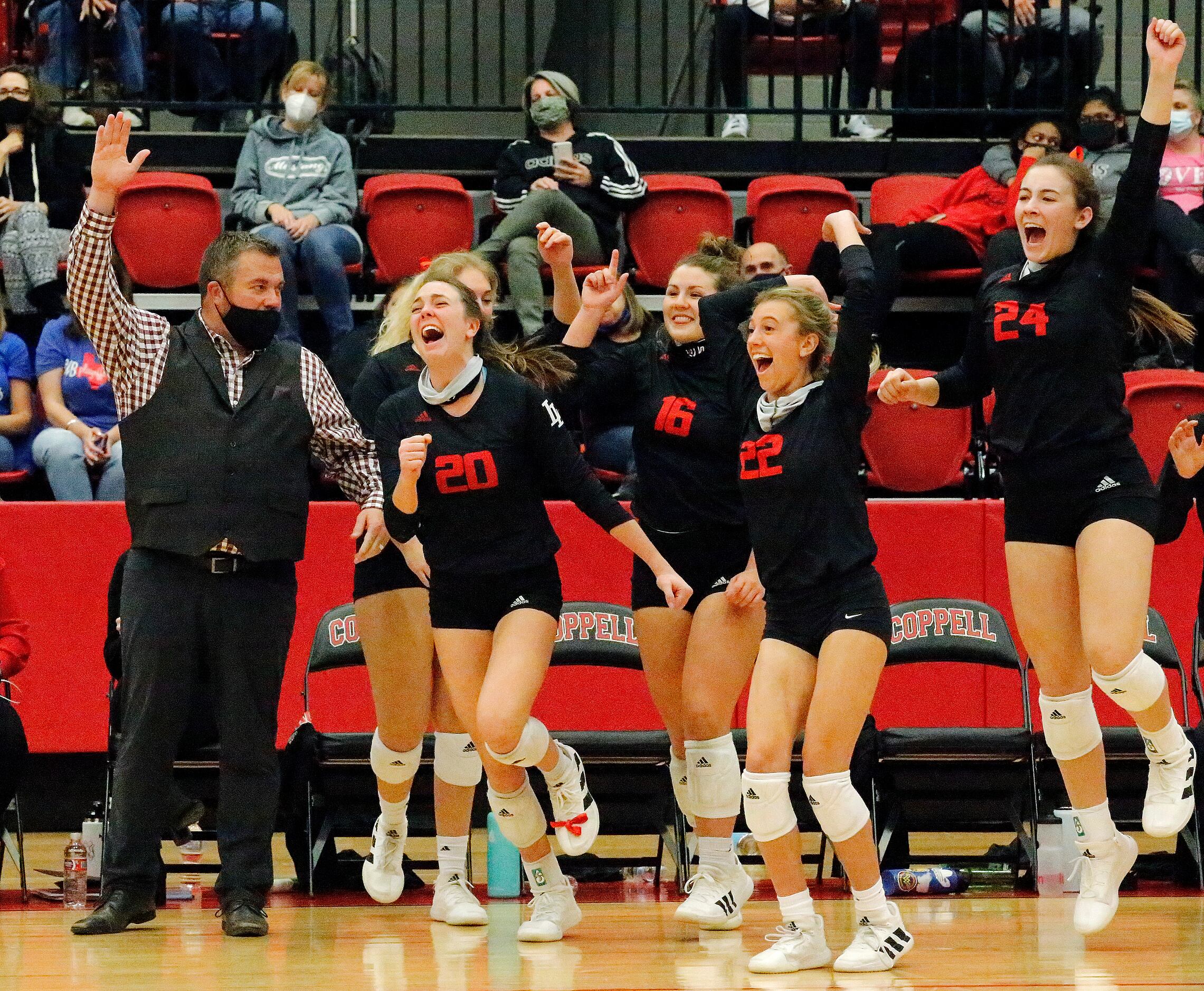 Lovejoy High School head coach Ryan Mitchell reacts with the bench as they sweep the match...