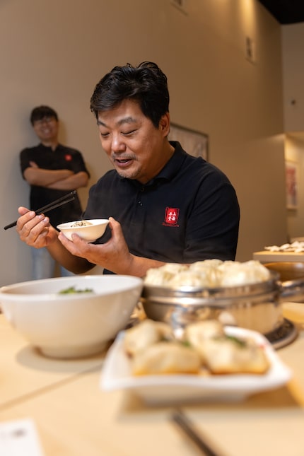 Chef Jimmy Li explains how he makes sheng jian bao at the new Plano location of his...