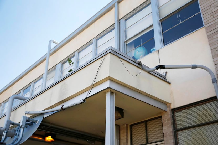 
A pipe dangles from wires at Rowe Elementary, which could get $4.4 million in repairs — 47...