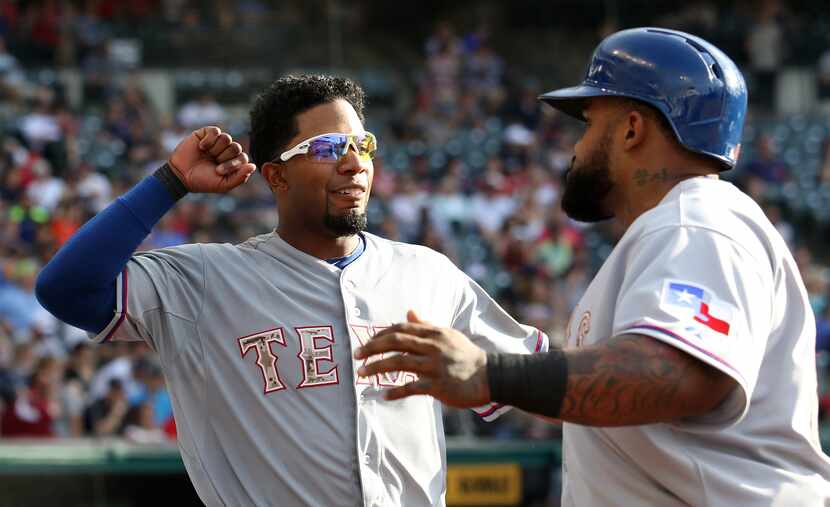 Texas Rangers Prince Fielder (R) celebrates with Elvis Andrus after hitting a RBI single...