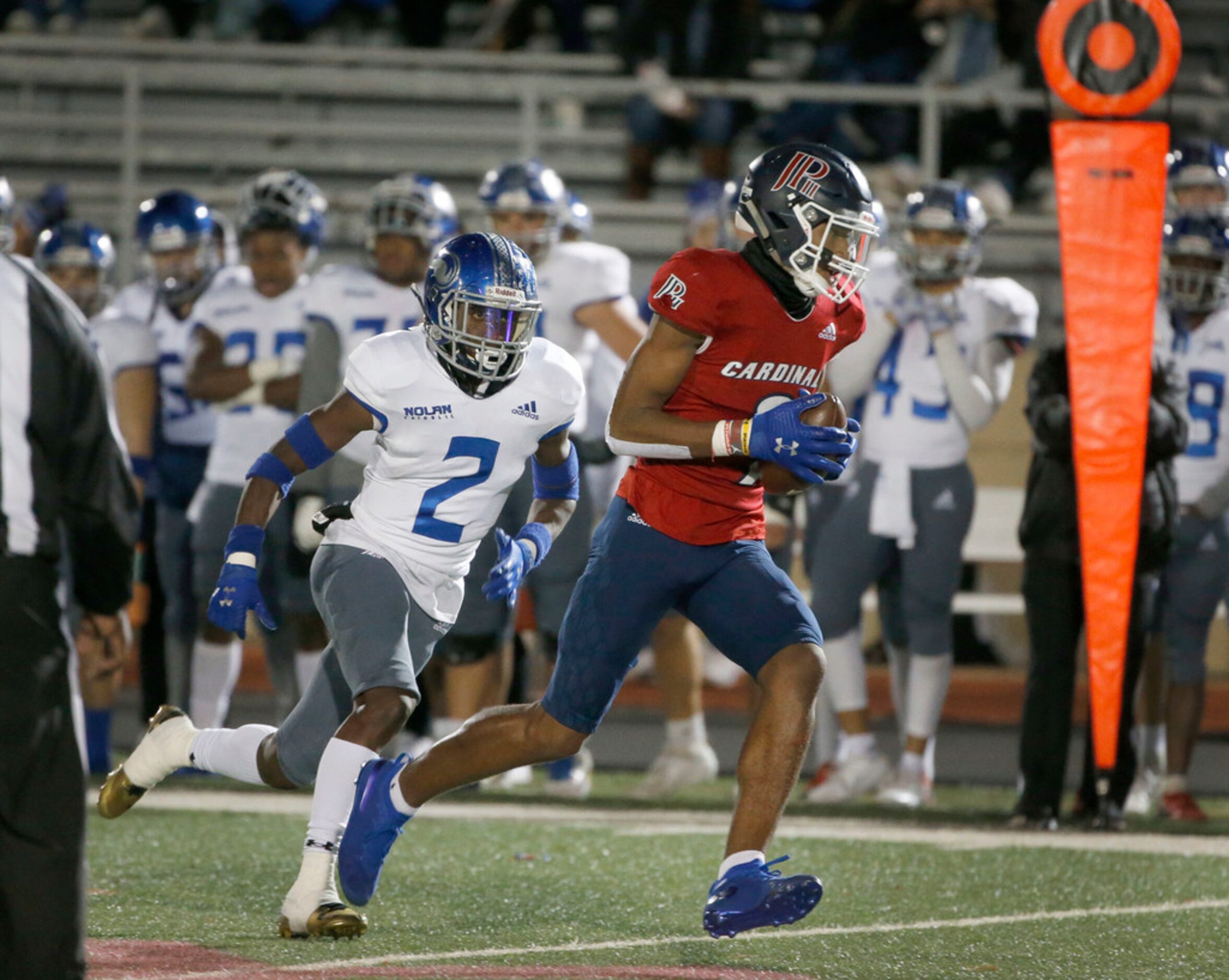 John Paul II Jerand Bradley (9) catches a pass and runs for a touchdown as he is chased by...