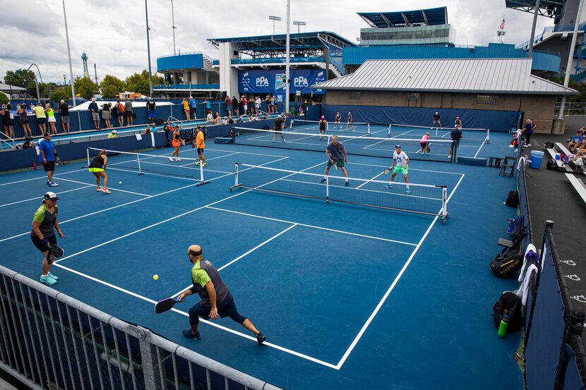 Amateur pickleball players participate in mixed double matches during the Professional...