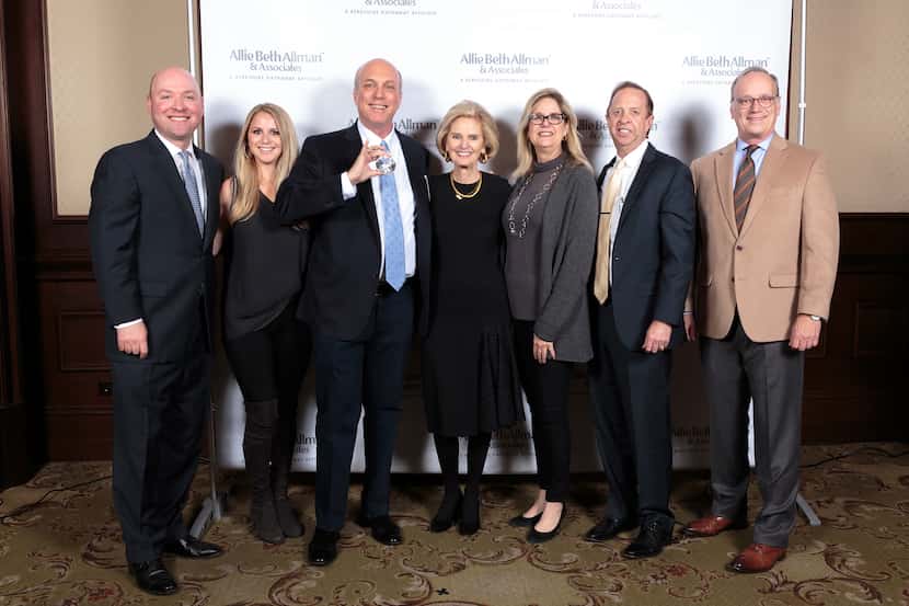 President/CEO Allie Beth Allman (center) congratulates The Urban Team for being named Top...