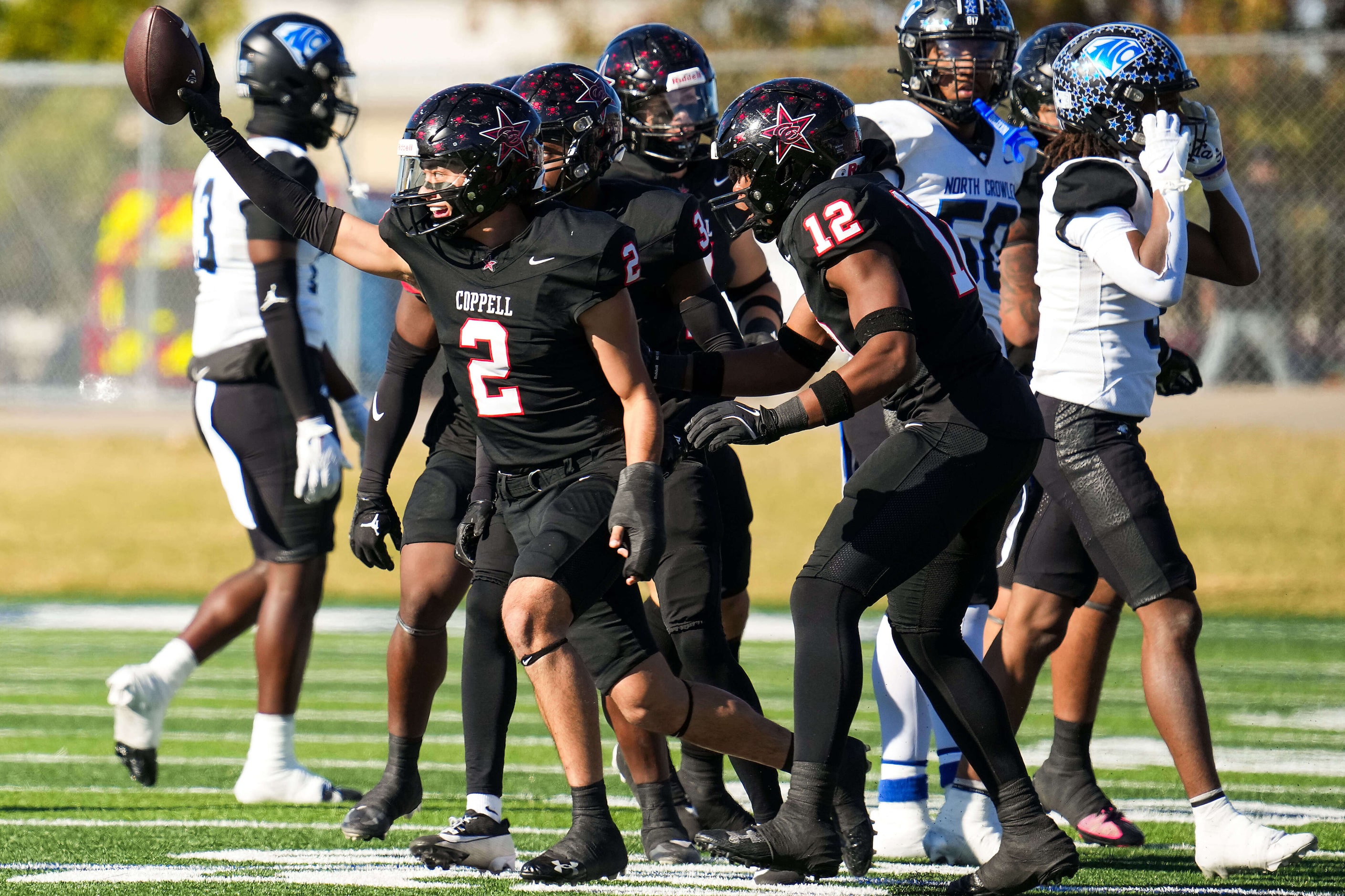 Coppell defensive back Matthew Neitzel (2) celebrates after intercepting a North Crowley...