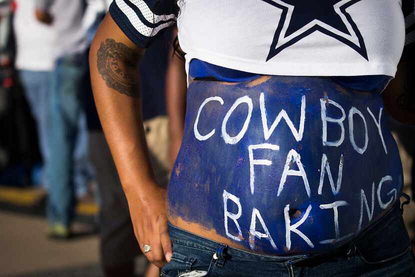 Dallas Cowboys fan Jennifer Davis, who is expecting a son to be born on February 2nd, shows...