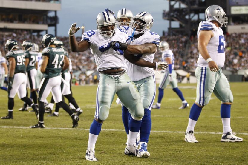 Dallas Cowboys running back Felix Jones (28) celebrates a touchdown with teammates Dallas...