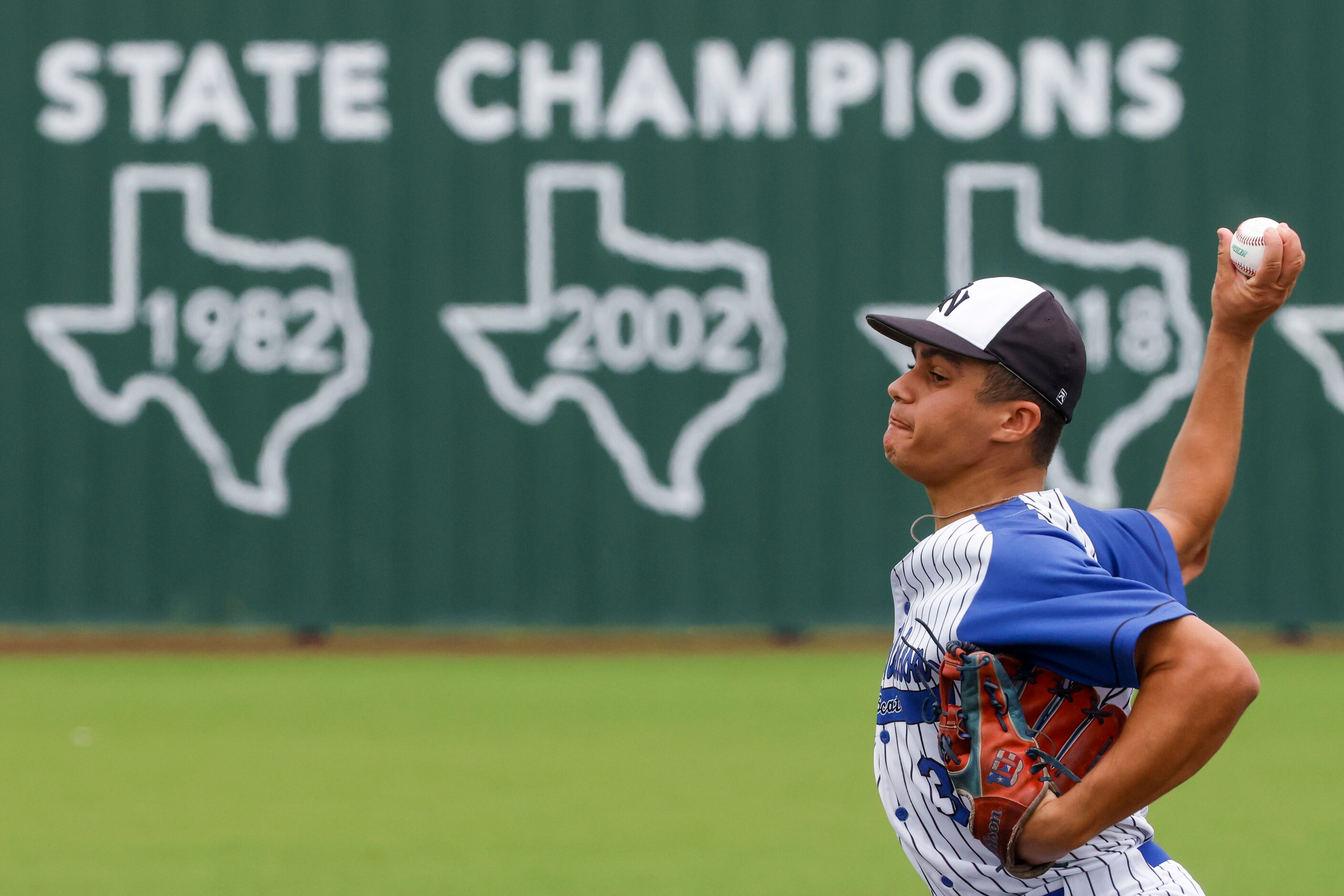 Byron Nelson High School’s Luis Santiago Castro throws a pitch during the first inning of a...