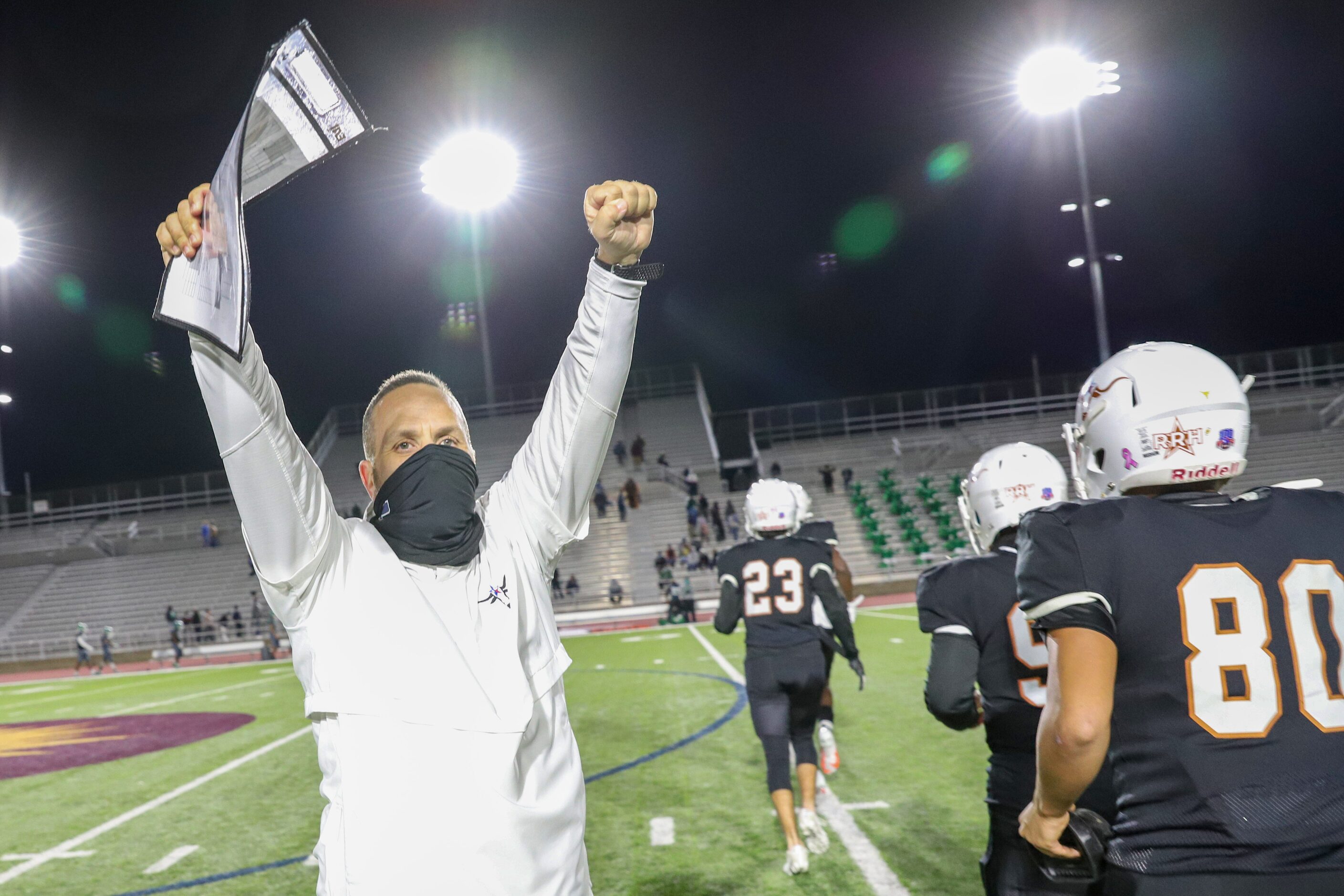 W.T. White head coach Tony Johnson celebrates a win against Bryan Adams at Loos Complex in...