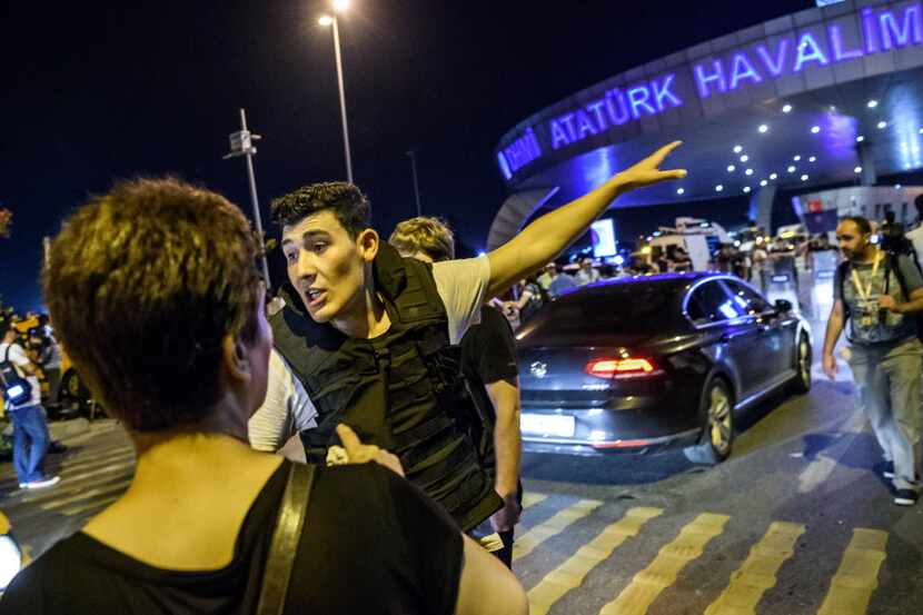 A Turkish police officer directs a passenger at Ataturk airport in Istanbul June 28, 2016...