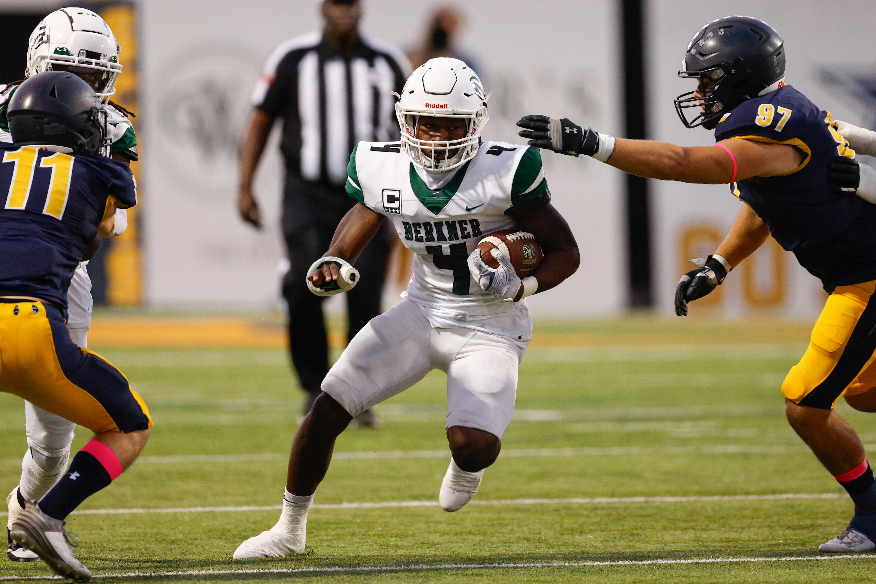 Highland Park offensive lineman Henry Richter (97) tackles Richardson Berkner running back...