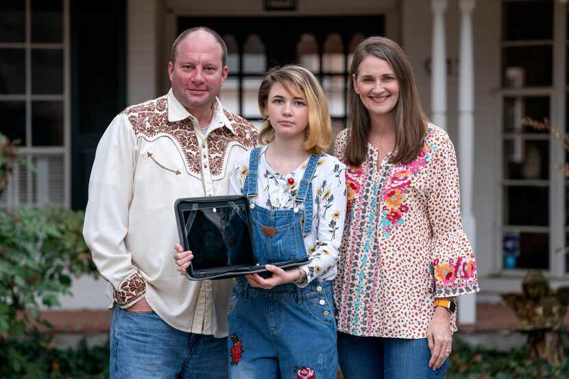 Mack and Elizabeth Simpson pose with their daughter Carson Simpson, an eighth-grader at West...