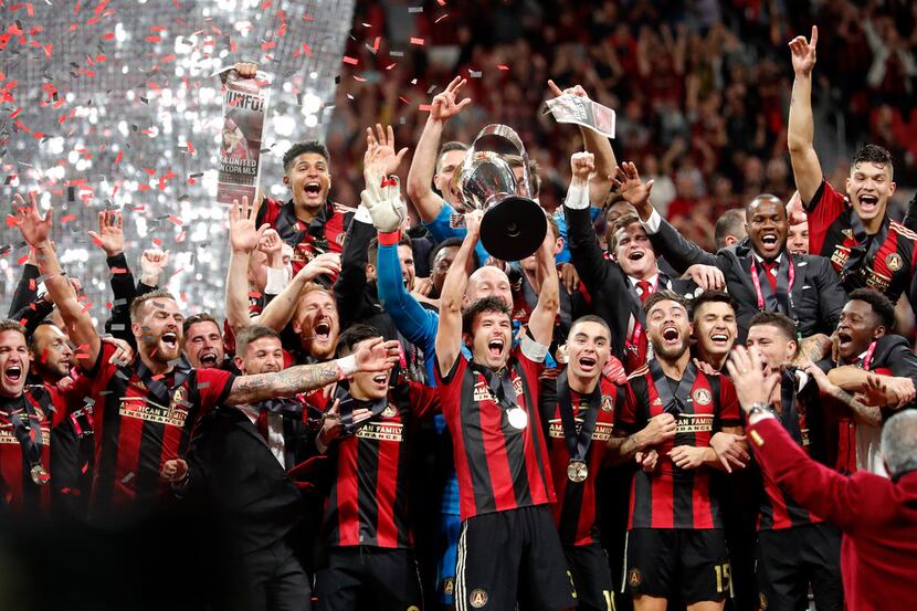 Atlanta United players celebrate after defeating Portland Timbers 2-0 to win the MLS Cup...