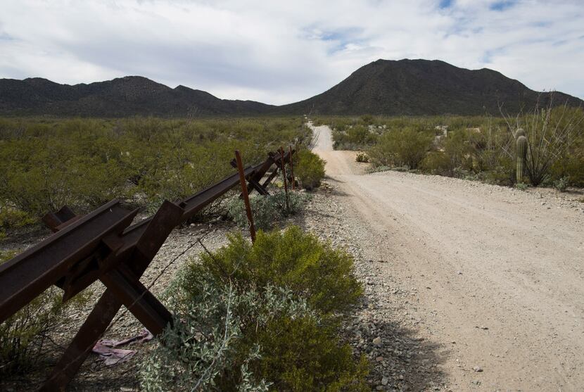 Vehicle barriers line a section of the U.S.-Mexico border that runs through Arizona.