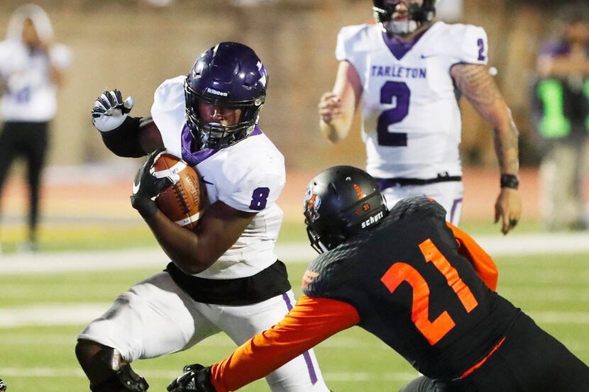 Tarleton State's Khalil Banks (8) is tackled by Texas Permian Basin's Emilio Solis (21) in...