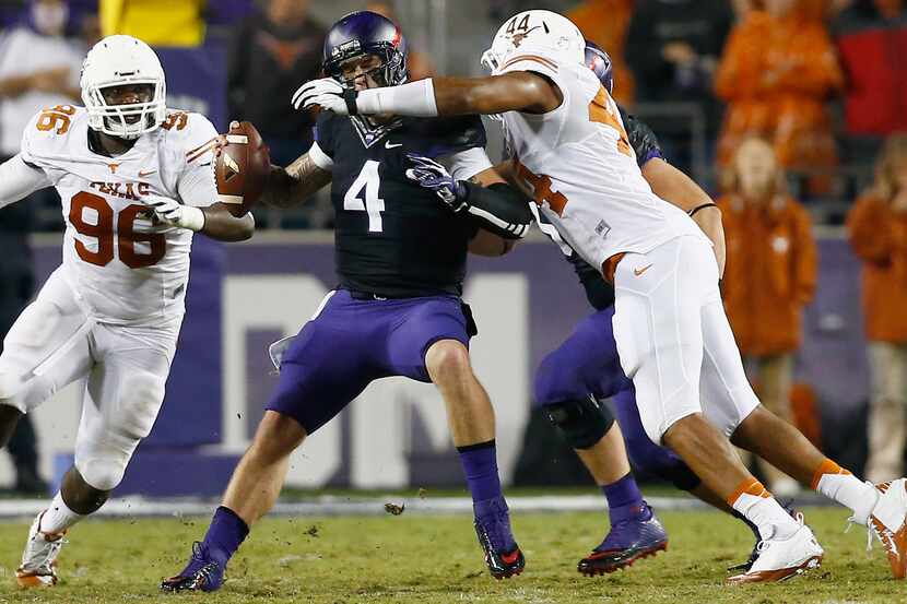 TCU QB Casey Pachall is sacked by Jackson Jeffcoat #44 of the Texas Longhorns as Chris...